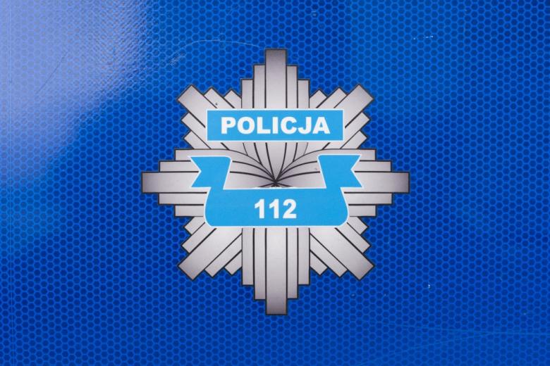 Logo w postaci gwiazdy z napisem policja i numerem 112 