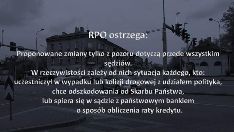 Napis "RPO ostrzega" na tle zdjęcia skrzyżowania w małym mieście