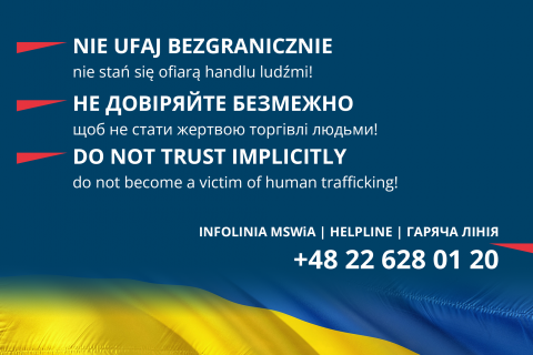 na granatowym tle biały napis w języku polskim, ukraińskim i angielskim o treści: Nie ufaj bezgranicznie. Nie stań się ofiarą handlu ludźmi, infolinia MSWiA 48 22 628 01 20 